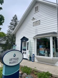 view of storefront and signage of Artisan Market
