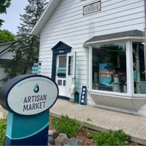 sign out front of Artisan Market